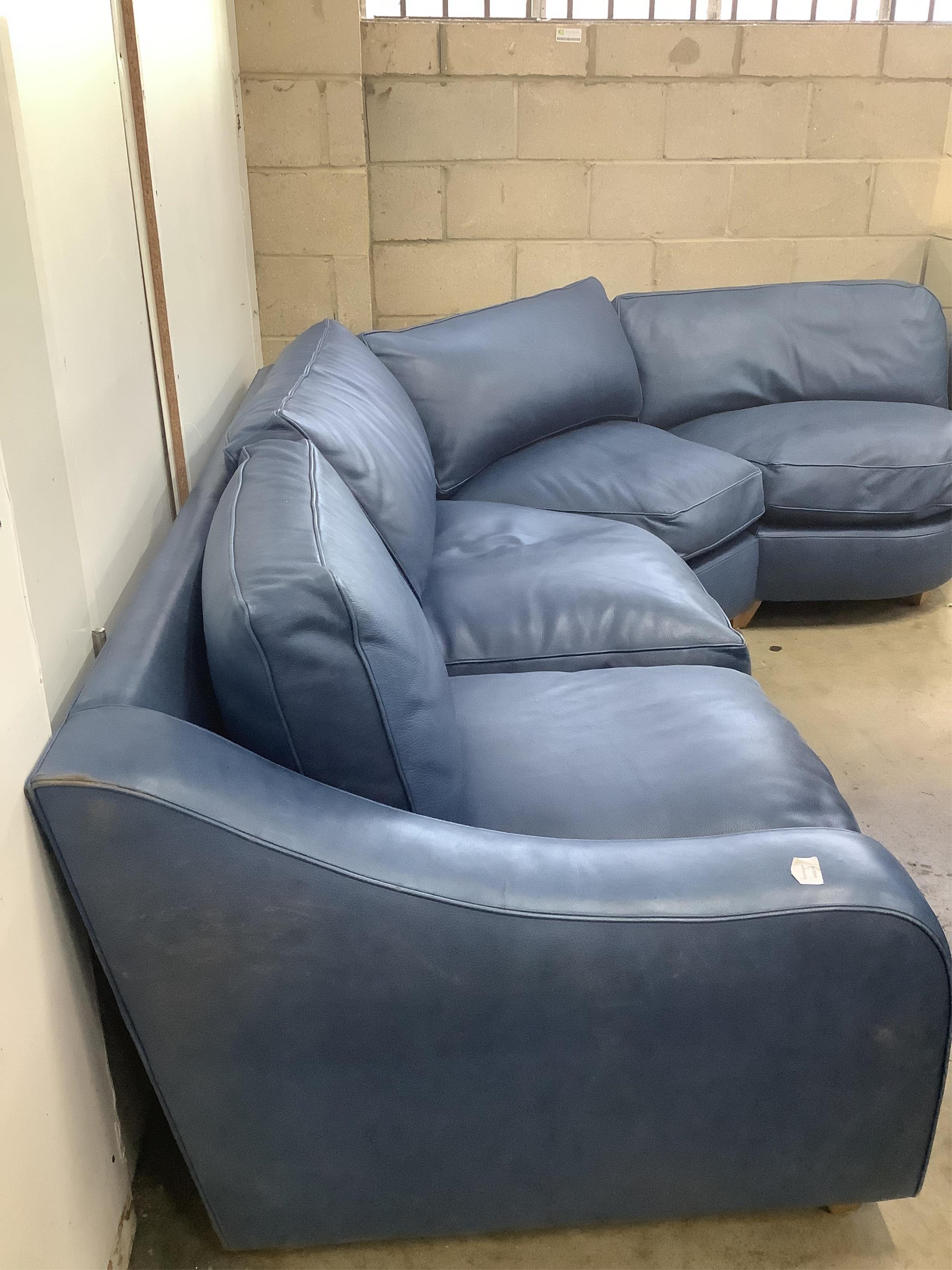 A Contemporary blue leather corner sofa, width 340cm, depth 96cm, height 73cm. Condition - fair